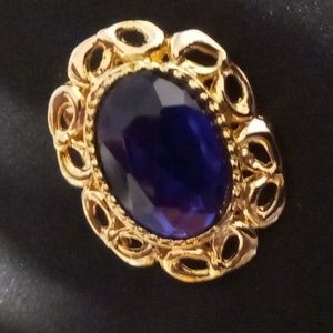 Hunters run large blue gem broach gold tone metal lapel pin.
